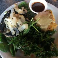 Portobella mushroom steak with mashed potatoes, gravy, and sauteed kale at Green Vegetarian Cuisine at Alon in San Antonio