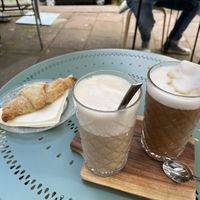 Galão and Dirty Chai Latte with oat milk and a vegan chocolate croissant   at Café Goldmund in Calw