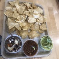 Chips with 3 dips: black bean w/ vegan crema, salsa, and guac   at Tacowala in Somerville