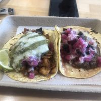 Taco on the left is the ‘papas de tamarindo’, taco on the right is ‘black magic’  at Tacowala in Somerville
