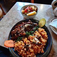 Aubergine, bulgar and side salad. at Mazaya in Krakow