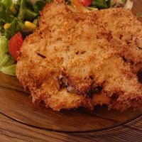Portobello-filled escalope with salad. at Veggira in Bilbao