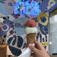 One scoop mint brownie, one scoop strawberry brownie with cone  at Sugar Killer in Athens