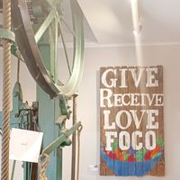 Interior sign by elevator at FoCo Cafe - Feeding Our Community Ourselves in Fort Collins