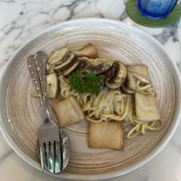 Spaghetti with trufle oil mushrooms and vegan cheese   at May Veggie Home in Bangkok