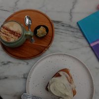 Best cinnamon roll ever and vegan !!! Cappuccino with soy milk was also delicious 😋 at Plant Dragon in Leuven