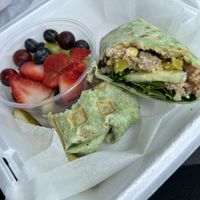 Quinoa wrap with side of fruit  at Just Love Coffee Cafe in Valdosta