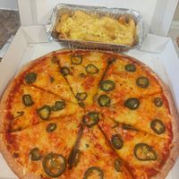 Vegan cheese n tomato garlic bread with jalapenos and a side of cheesy chips at Milan Takeaway in South Shields