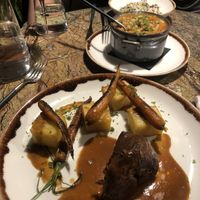 The ‘roasted loin’ with fondant potatoes. And the ‘tripe’ in the background  at Jardineiro - Vegan Kitchen in Porto
