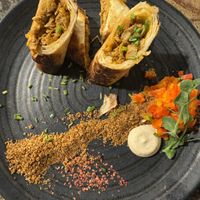 Spicy meat tortilla, pico de gallo and sour cream  at Jardineiro - Vegan Kitchen in Porto