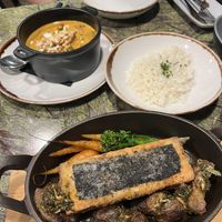 Curry and the baked fish - fish was a real standout! Super flavourful and the potatoes were perfect alongside it  at Jardineiro - Vegan Kitchen in Porto
