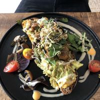 Avocado smash on Toast   at Alua Catering Cafe in Dresden