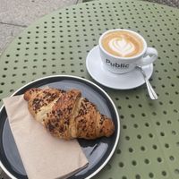 Chocolate croissant with a cappuccino   at Alua Catering Cafe in Dresden