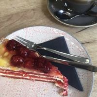 Raspberry cake with hot chocolate and oat milk  at Café Bigoti in Leipzig
