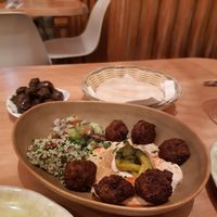 Falafel with hummus + olives in pesto & pita bread at Cafe Manah in Lisbon