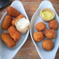 Left: Kimchi Croquettes, Right: Vegan Bitterballen made with Jackfruit. (There were 6 of each but I ate one of each before taking the photo). at Blue  in Amsterdam