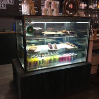Cake cabinet. Minimal vegan options, clearly labelled.   at Lenox Avenue in Blackwood