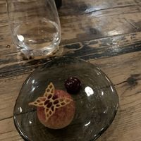 Appetiser dessert. Ice cream with crispy dough around and blackcurrant sauce   at Høst in Copenhagen