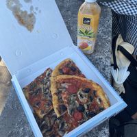Two types of vegan pizza to go with a drink  at La Follia in Rome