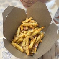 Fries with vegan bacon and vegan Parmesan  at Mama Tierra - Acropolis in Athens