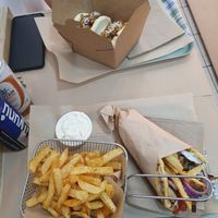 Jackfruit buns and gyros wrap with fries and mayonnaise at Mama Tierra - Acropolis in Athens