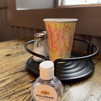 Hand sanitizer on table but no chilli peppers   at Pizza Projekt in London