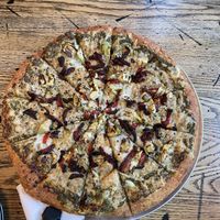 Vegan Pizza - basil pesto sauce with artichoke, sun dried tomatoes and roasted garlic   at Pizza Projekt in London