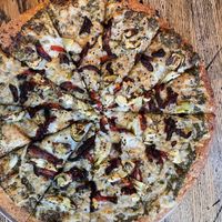 Vegan Pizza - basil pesto sauce with artichoke, sun dried tomatoes and roasted garlic   at Pizza Projekt in London