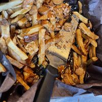 Vegan Poutine with vegan “sausages” NOT. (More like hot dogs)  at Pizza Projekt in London