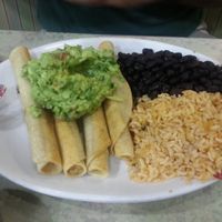 Soy chicken taquitos with rice, beans, and guacamole. at Mother's Market Kitchen in Irvine