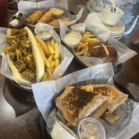 Top - Fried Pickles & Chicken Sandwich on pretzel bun    at The Green Table in Palm Harbor