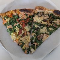 A slice of each of their vegan pizzas at Ignite Pizzeria in Vancouver