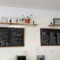 Menu with savoury power bowls, salads, smoothie bowls and shakes. at Vibe Juicery in Moncton