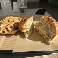 Crispy chicken sandwich with Parmesan truffle fries  at Rhino Vegan Beat in Mykonos