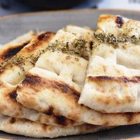 Pita bread with olive oil at Rhino Vegan Beat in Mykonos