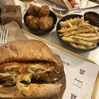 Bad rhino burger, oregano chips, chicken nuggets, chicken gyros  at Rhino Vegan Beat in Mykonos