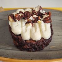 chocolate brownie with whipped cream and chocolate covered popcorn at Rhino Vegan Beat in Mykonos