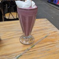 Coconut Berry smoothie with whipped cream! at Querida Simona in Mexico City