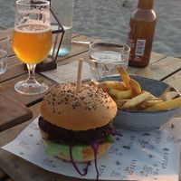 Vegan green chili burger (the right one) with fries. The left one is not vegan! at Kayuca in Zandvoort