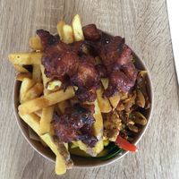 Delicious spicy tofu, mango samosa with salad and chips.  at Earthling in Bournemouth