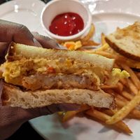 The Vegan Becky - sourdough, hash brown patty, vegan American cheese, just egg, veggies and a chipotle sauce. The fries in the background were so incredibly crunchy and delicious. at Americano Pie Bar in Islip