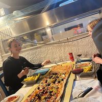 3 tastes  metre long pizza , one with mozzarella and two vegan  at Ristorante Pizzeria Lido in Alghero