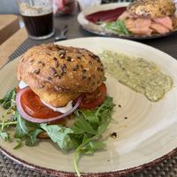 Vegan breakfast bagel with a breaded chicken patty, tomato, lettuce, onion and mayo - served with a hummus on the sidee  at Galripo in Peso Da Regua