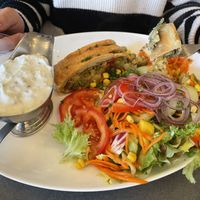 Kartoffelstampf in Blätterteig mit Kräuterquark und Salat  at Cafe Restaurant Am Flugplatz in Wyk Auf Foehr
