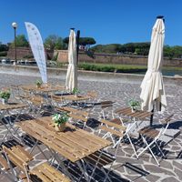 Outside tables at Rios Poke in Livorno