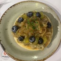 Flatbread with smoked aubergine, caramelised onion, blueberries and lemon gel  at Al Punto in Gandia