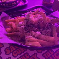 Garlic parm loaded fries with parsley   at The Saucy Cow in Dublin