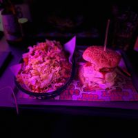 Cheeseburger loaded waffle fries, with gherkins , burger sauce, lettuce and crumbled burger. The buckfast burger ( buckfast bbq sauce) onion rings , smashed beef , cheese. 😋😋 at The Saucy Cow in Dublin