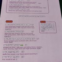 Back of the menu with the sides  at The Saucy Cow in Dublin