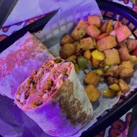Salt & chili breakfast burrito with home fries  at The Saucy Cow in Dublin